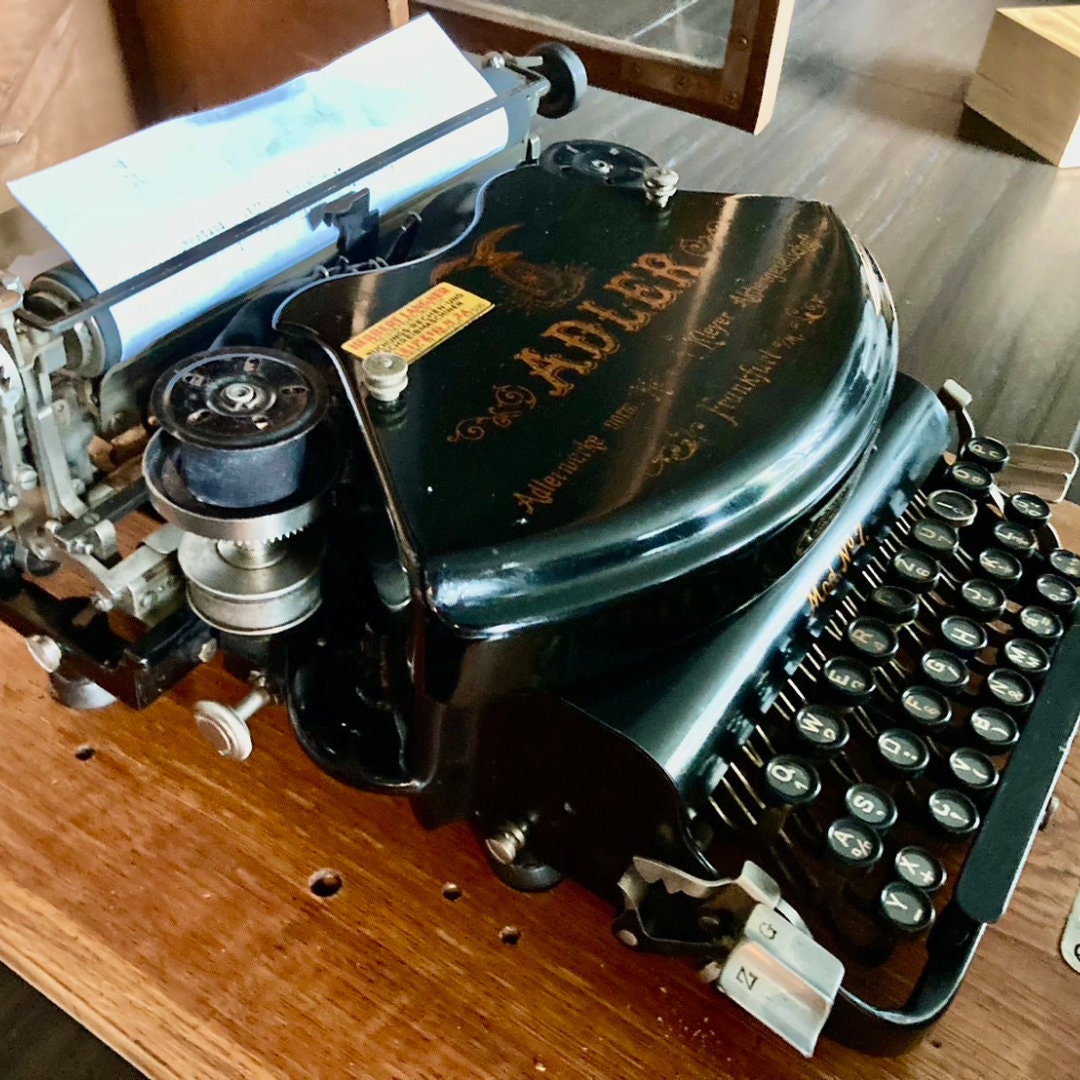 Adler model no.7 antique typewriter with wooden box.